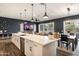 Modern kitchen with a large island, stainless steel appliances, and stylish pendant lighting at 6858 E Orion Dr, Scottsdale, AZ 85257