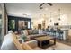 Spacious living area featuring a large kitchen island with bar seating and comfortable seating arrangements at 6858 E Orion Dr, Scottsdale, AZ 85257