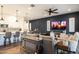 Open-concept living area featuring a large kitchen island and a cozy living space with a TV at 6858 E Orion Dr, Scottsdale, AZ 85257