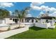 Stunning backyard featuring a sleek pool, modern patio, and outdoor kitchen area perfect for entertaining at 7014 E Palo Verde Ln, Paradise Valley, AZ 85253