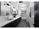 Modern bathroom with double vanity sinks, stylish mirrors, and a walk-in shower for a luxurious experience at 7014 E Palo Verde Ln, Paradise Valley, AZ 85253