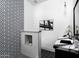 Contemporary bathroom showcasing a geometric tile wall, marble countertop vanity, and modern black and white accents at 7014 E Palo Verde Ln, Paradise Valley, AZ 85253