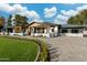 Beautiful single-story home with manicured landscaping, a circular driveway, and a covered front porch at 7014 E Palo Verde Ln, Paradise Valley, AZ 85253