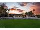Beautiful modern home with manicured lawn, custom hardscape, dark trim, and inviting curb appeal at 7014 E Palo Verde Ln, Paradise Valley, AZ 85253