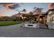 Beautiful front exterior showcasing meticulous landscaping and a welcoming entrance with pergola at 7014 E Palo Verde Ln, Paradise Valley, AZ 85253