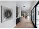Elegant hallway featuring hardwood floors, stylish bar area, and seamless indoor-outdoor flow to a beautiful view at 7014 E Palo Verde Ln, Paradise Valley, AZ 85253