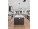 Modern kitchen featuring a large island, sleek countertops, stainless steel appliances, and pendant lighting at 7014 E Palo Verde Ln, Paradise Valley, AZ 85253