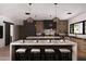 Spacious kitchen featuring a double island, modern pendant lights, and stainless steel appliances at 7014 E Palo Verde Ln, Paradise Valley, AZ 85253