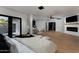 Spacious main bedroom with hardwood floors, a fireplace, and an adjacent outdoor space at 7014 E Palo Verde Ln, Paradise Valley, AZ 85253