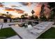 Luxury pool area boasting elegant tile work, water features, and an outdoor kitchen at 7014 E Palo Verde Ln, Paradise Valley, AZ 85253