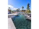Resort-style pool showcasing cascading water features, modern tiling, and mountain views at 7014 E Palo Verde Ln, Paradise Valley, AZ 85253