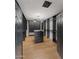 Spacious walk-in closet with custom shelving, dark wood design, and ample storage space at 7014 E Palo Verde Ln, Paradise Valley, AZ 85253
