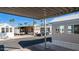Picturesque view of a well-maintained neighborhood showcasing charming homes and lush palm trees under a clear blue sky at 834/837 S Beryl/Aquamarine Dr, Apache Junction, AZ 85119