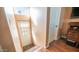 Staircase leading to an entryway with an exterior door and closet at 834/837 S Beryl/Aquamarine Dr, Apache Junction, AZ 85119
