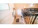 Staircase leading to an entryway with an exterior door and closet at 834/837 S Beryl/Aquamarine Dr, Apache Junction, AZ 85119
