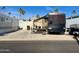 Park model home featuring a large RV with covered patio at 834/837 S Beryl/Aquamarine Dr, Apache Junction, AZ 85119