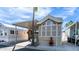 Charming home featuring covered parking, a cozy seating area, and lush palm trees against a bright blue sky at 834/837 S Beryl/Aquamarine Dr, Apache Junction, AZ 85119