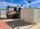 Park model home featuring a large RV and storage shed at 834/837 S Beryl/Aquamarine Dr, Apache Junction, AZ 85119