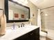 Stylish bathroom with a marble countertop vanity, modern fixtures, and a shower-tub combination at 9235 N 100Th Pl, Scottsdale, AZ 85258