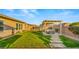 Beautiful backyard featuring lush lawn and a relaxing hot tub, perfect for unwinding after a long day at 10455 E Thatcher Ave, Mesa, AZ 85212