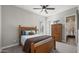 Cozy bedroom featuring a wood bed frame, with an attached bathroom for added convenience at 10455 E Thatcher Ave, Mesa, AZ 85212