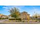 Charming home showcases a neutral color palette, well-manicured landscaping and inviting curb appeal at 10455 E Thatcher Ave, Mesa, AZ 85212