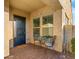 Cozy front porch featuring outdoor seating, a decorative welcome mat, and covered entryway at 10455 E Thatcher Ave, Mesa, AZ 85212
