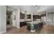 Gourmet kitchen with stainless steel appliances, granite countertops, and a spacious island with bar seating at 10455 E Thatcher Ave, Mesa, AZ 85212
