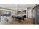 A modern open-concept kitchen featuring a spacious island with seating and stainless steel appliances at 10455 E Thatcher Ave, Mesa, AZ 85212