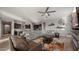 Spacious living room featuring hardwood floors, comfortable seating, and an open floor plan at 10455 E Thatcher Ave, Mesa, AZ 85212