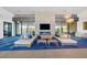 Comfortable lounge area featuring a stone fireplace and stylish decor at 10455 E Thatcher Ave, Mesa, AZ 85212