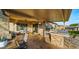 Wonderful outdoor living with grill, bar, and covered seating, creating an ideal space for entertaining and relaxation at 10455 E Thatcher Ave, Mesa, AZ 85212