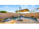 Inviting swimming pool with a relaxing waterfall feature, creating a serene and enjoyable outdoor space at 10455 E Thatcher Ave, Mesa, AZ 85212