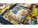 Aerial view of property featuring a solar panel roof, ample patio space, and verdant landscaping at 11737 N 143Rd Dr, Surprise, AZ 85379
