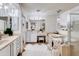 Bright bathroom offering dual sinks, lots of counter space, a soaking tub, and separate glass shower at 11737 N 143Rd Dr, Surprise, AZ 85379