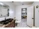 Bathroom with a modern glass sink, and a view into the laundry room at 11737 N 143Rd Dr, Surprise, AZ 85379