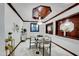 Elegant dining room with modern lighting, wood trim ceiling, and a table set for a sophisticated dining experience at 11737 N 143Rd Dr, Surprise, AZ 85379
