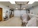 Spacious garage with epoxy flooring and ample storage space and garage door at 11737 N 143Rd Dr, Surprise, AZ 85379
