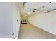 Clean, well-lit garage featuring epoxy flooring and ample space for parking at 11737 N 143Rd Dr, Surprise, AZ 85379