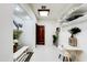 Stylish hallway with a white desk, open shelving, and modern accents at 11737 N 143Rd Dr, Surprise, AZ 85379