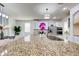 A modern kitchen featuring granite countertops, stainless steel appliances, and an open layout at 11737 N 143Rd Dr, Surprise, AZ 85379