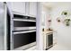 Features modern stainless steel appliances and next to a countertop with a beverage fridge at 11737 N 143Rd Dr, Surprise, AZ 85379