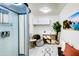 Well-lit laundry room with modern appliances and extra storage at 11737 N 143Rd Dr, Surprise, AZ 85379