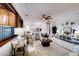 An open-concept floorplan with living room and kitchen and a dining area featuring natural light at 11737 N 143Rd Dr, Surprise, AZ 85379