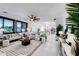 Bright and airy open-concept living space with neutral tones and modern decor with view to kitchen at 11737 N 143Rd Dr, Surprise, AZ 85379