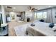 Open main bedroom with a seating area, makeup table, and ensuite bathroom with lots of natural light at 11737 N 143Rd Dr, Surprise, AZ 85379