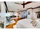 Spacious main bedroom with hardwood floors, office area and ceiling fan at 11737 N 143Rd Dr, Surprise, AZ 85379