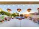 Inviting outdoor patio with a fire pit and string lights, perfect for relaxing at 11737 N 143Rd Dr, Surprise, AZ 85379