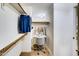 Organized walk-in closet featuring a closet organizer and a separate work space at 11737 N 143Rd Dr, Surprise, AZ 85379