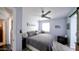 Serene bedroom with neutral tones, a ceiling fan, and stylish decor that create a relaxing retreat at 1207 E Alice Ave, Phoenix, AZ 85020